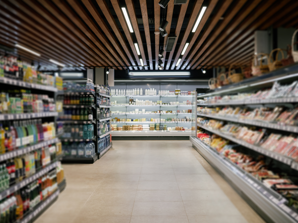 Supermarket aisle stocked with goods